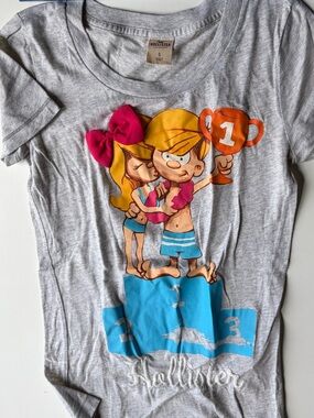 Vintage Hollister Gray Graphic Tee with Pink Bow and Blue Accents